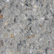un campione di materiale edile, forse un conglomerato cementizio con aggregati di varia granulometria.