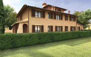 Villa con facciata color terra e persiane in legno scuro.