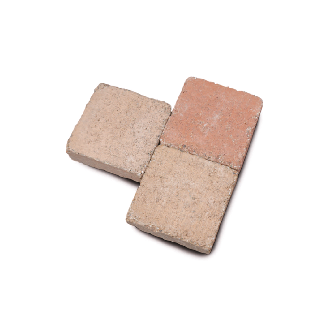 Tre mattoni quadrati, disposti a forma di "L", nei toni del beige e rosato.
