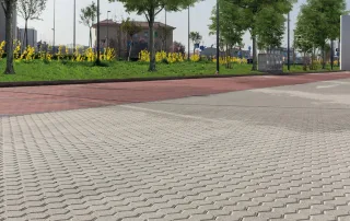 Pavimentazione in blocchi esagonali in cemento grigio.